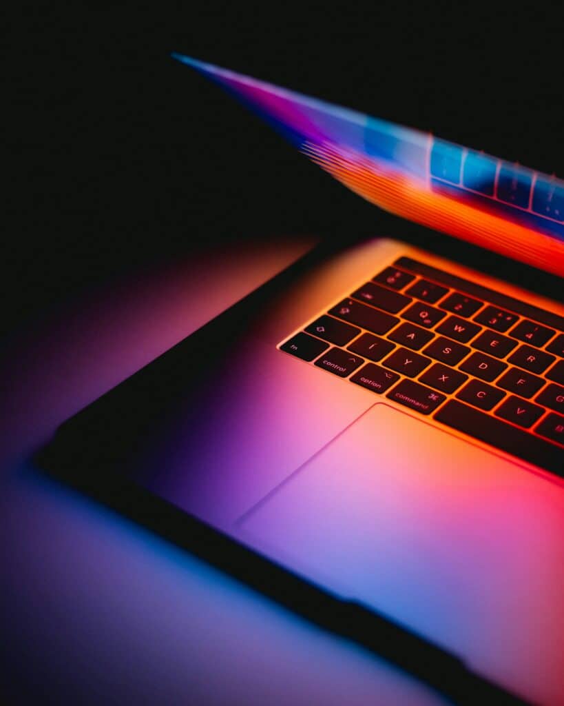Laptop with vibrant display representing proactive IT network support and secure network support services